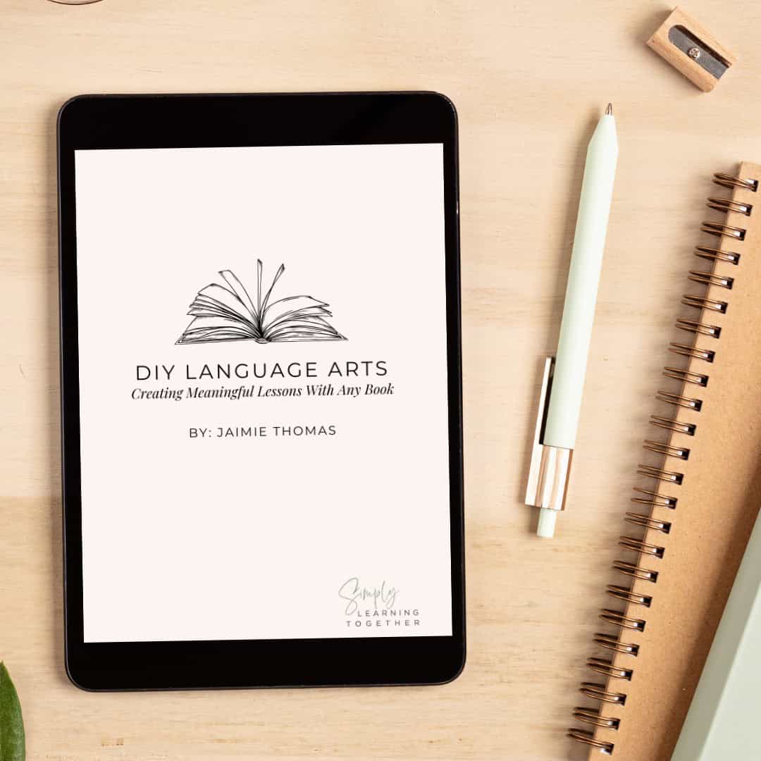 DIY-LA-Ebook-Photos.png DIY language arts digital lesson on tablet screen with notebook and pen on wooden desk.