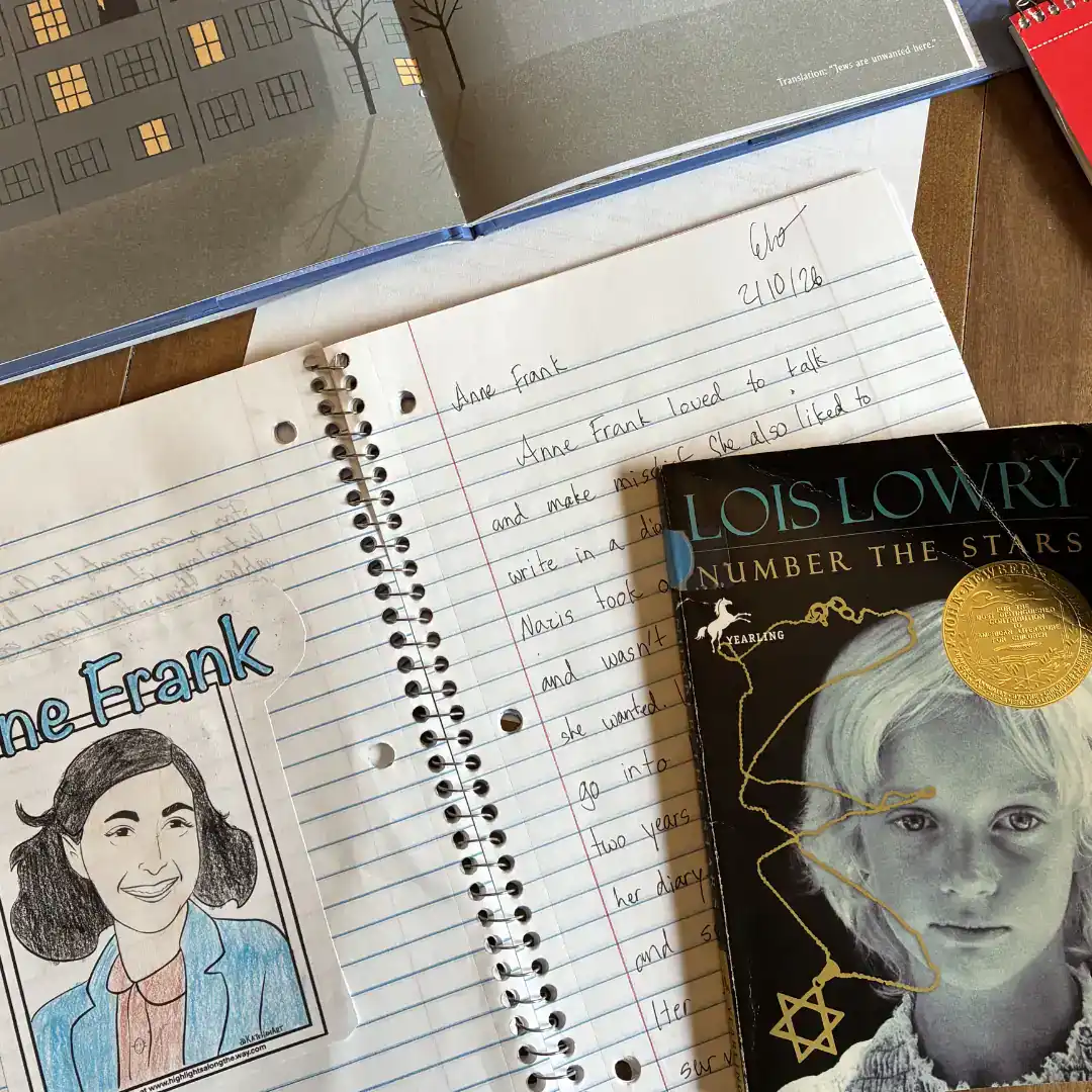 Teaching Writing in Our Homeschool Without Curriculum Anne Frank notebook with handwritten text and illustration, and Lois Lowry book cover, "Number the Stars"